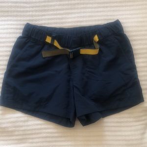 The North Face’s blue Paramount Hiking Shorts with yellow waist belt, in medium